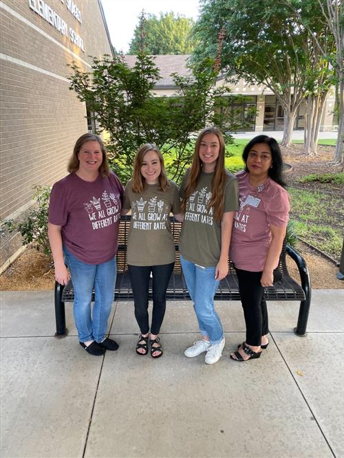 The Skaggs Instructional Support Team smiling in their team shirts.